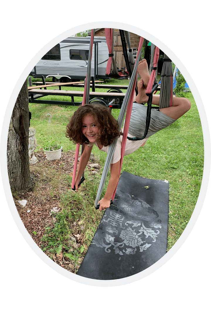girl in Supergirl pose trapeze